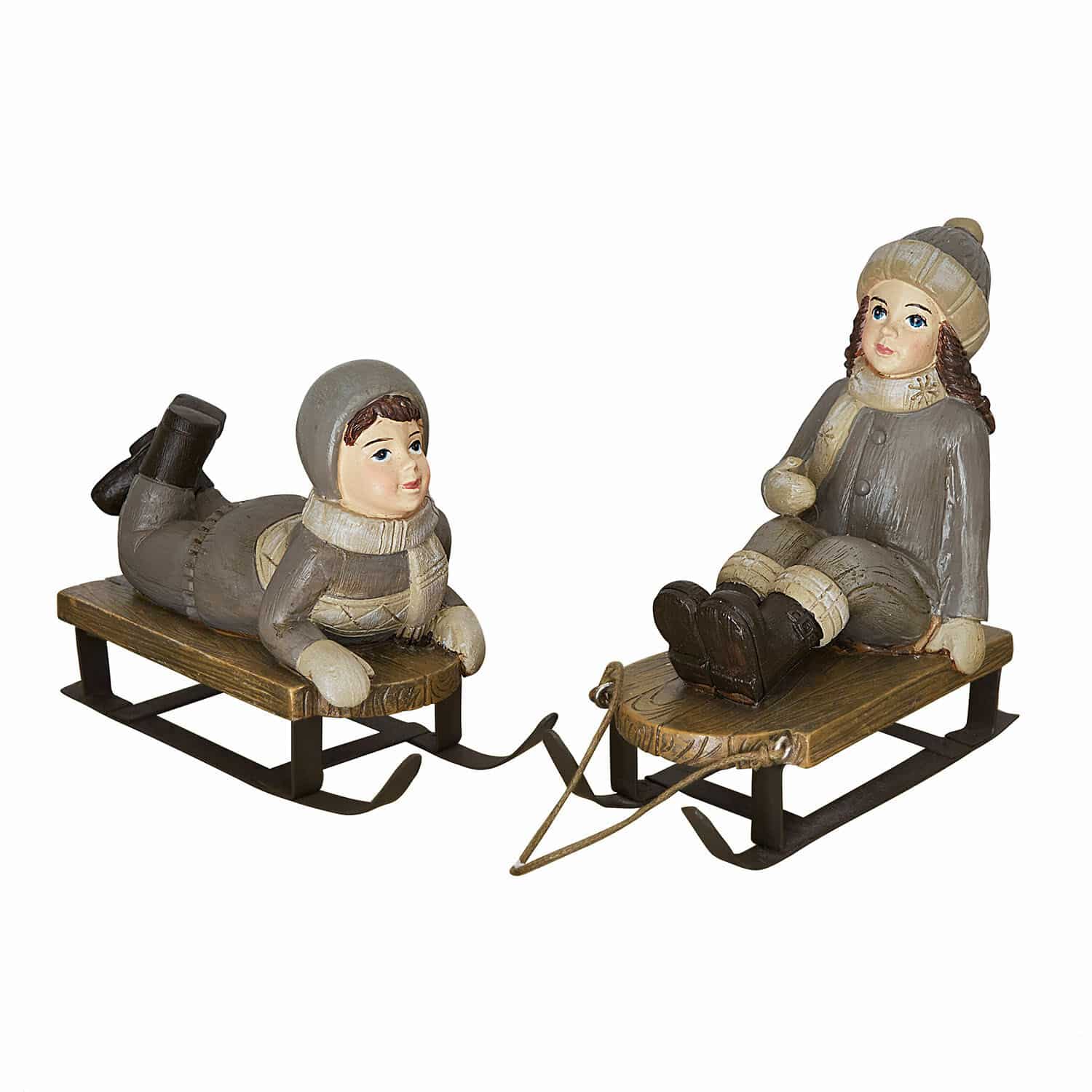 Deko-Figur 2er Set Xavienne Figuren von Kindern auf Holzschlitten in grauer Kleidung, winterliche Wohnungsdekoration