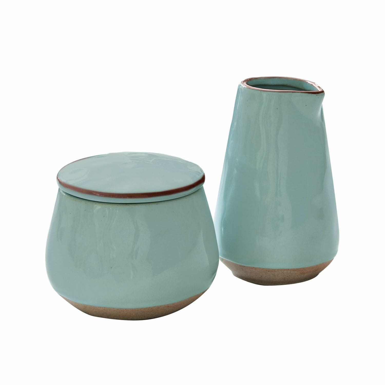 Set aus mintgrünen Keramikbehältern mit braunen Akzenten, stilvolle Wohnaccessoires