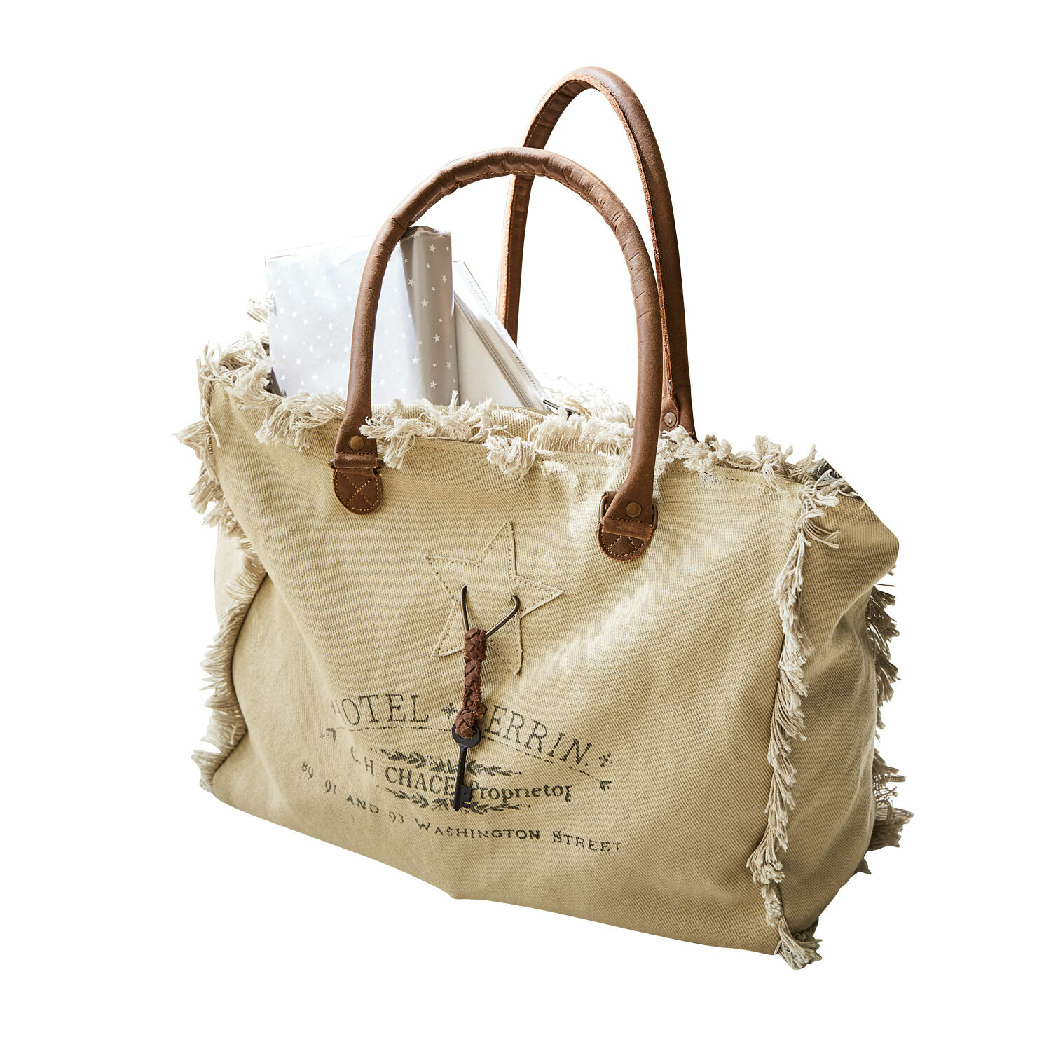 creme Elora Tasche aus cremefarbenem Stoff mit braunen Griffen und dekorativem Fransenrand im Vintage-Stil