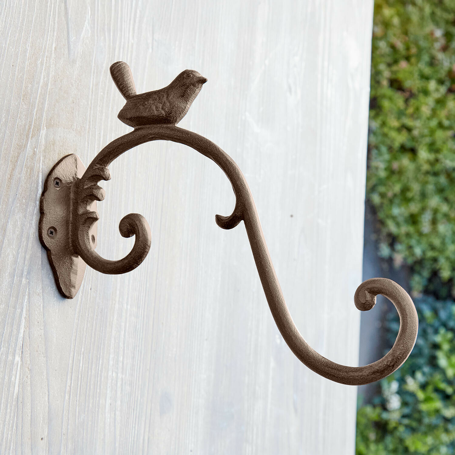 Brauner Metall-Wandhaken mit dekorativem Vogel und geschwungenem Arm zum Aufhängen