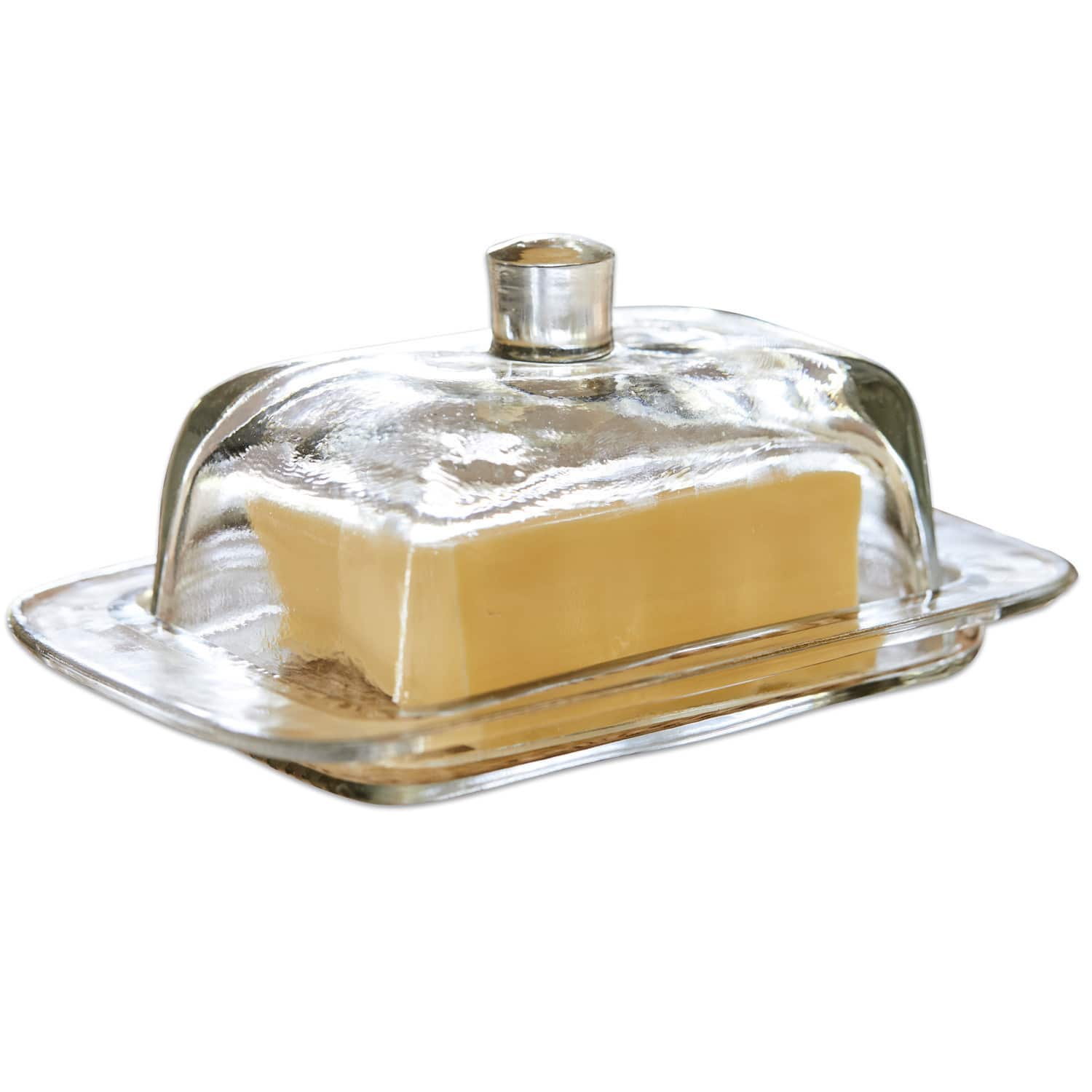 Butterdose Annie Glas-Butterdose mit transparenter Haube und Stück gelber Butter auf weißem Hintergrund