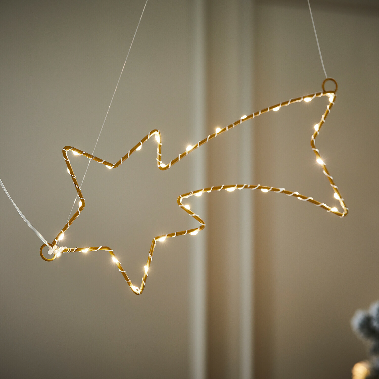 LED-Sternschnuppe Glittera Goldene Lichterdekoration in Sternform mit warmweißen LEDs, festlicher Weihnachtsschmuck