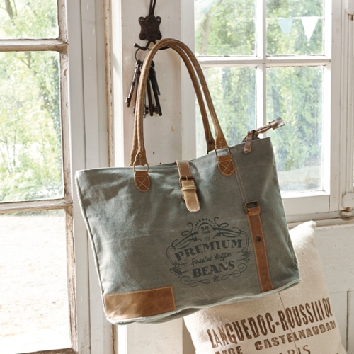 Graue Stofftasche mit braunen Ledergriffen und Premium-Kaffeebohnen-Aufdruck