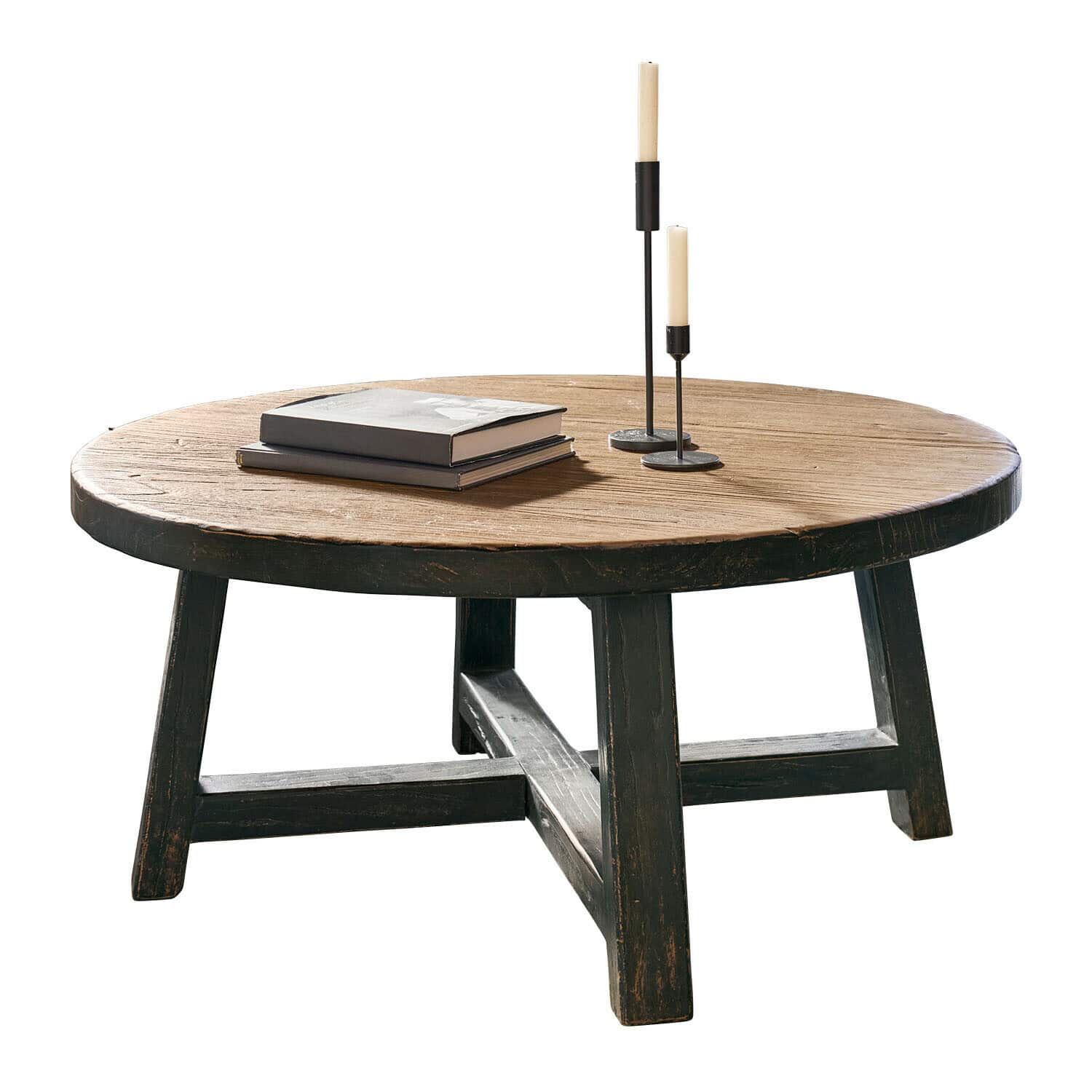 Runder Couchtisch aus Holz in Natur- und Schwarzfarben mit Büchern und Kerzen dekoriert